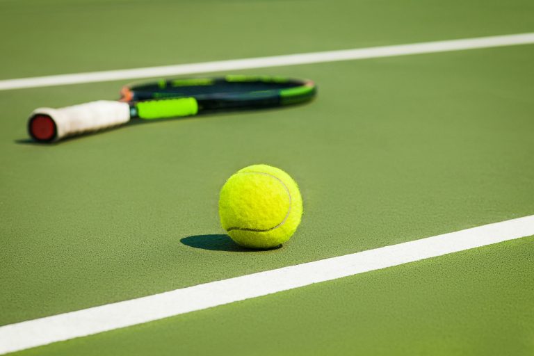 The tennis ball on a tennis court